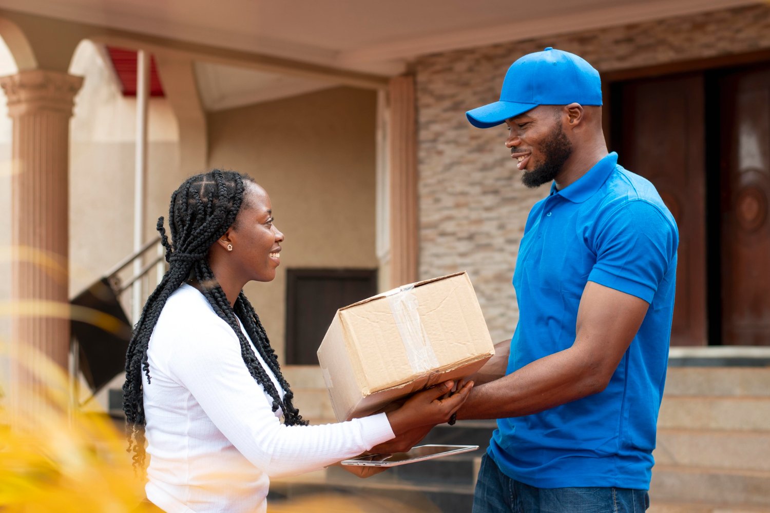 a customer receiving a parcel from a delivery man